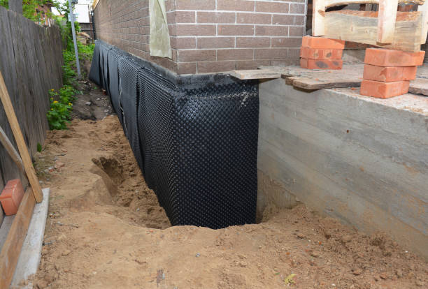 SJ Waterproofing Pros technician performing targeted Emergency Waterproofing assessment in Trenton, OH